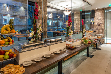 Restaurant interior with food buffet table
