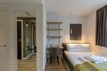 Interior of a hotel bedroom with master bed