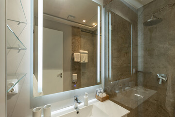 Bathroom interior with glass shower cabin