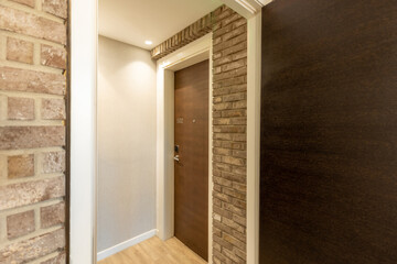 Hotel corridor interior with brick wall decoration