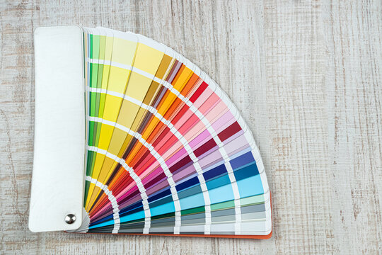 catalog in bright color palette close-up on desk
