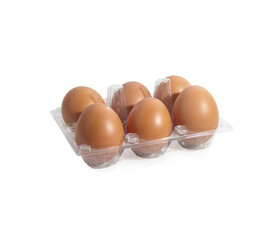 chicken eggs in a plastic container isolated on a white background