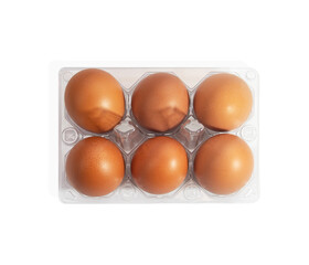 chicken eggs in a plastic container isolated on a white background