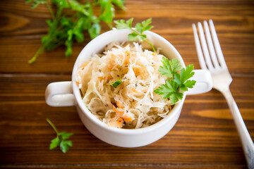 sauerkraut with carrots and spices in a bowl