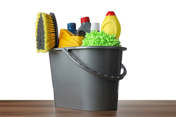 Grey bucket with car care products on wooden table against white background