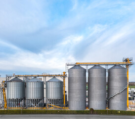 Industrial storage or silo tanks in a row with copy space above
