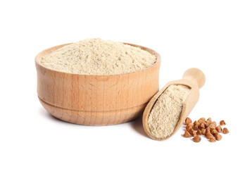 Bowl and scoop of buckwheat flour on white background
