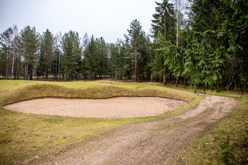 Fototapeta na wymiar Picteresque green golf hill field with holes