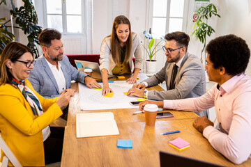 Group of business people having a meeting in office.