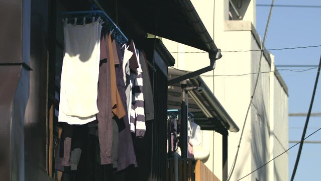 Laundries bring dried in the wind, with sunlights, from the old building's veranda 