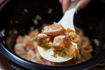 Raw pork pieces marinated in bowl