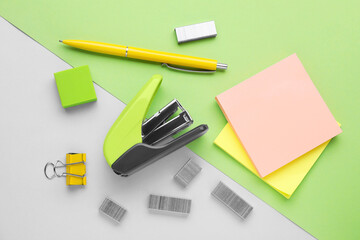 Flat lay composition with new stapler on color background