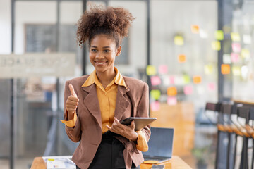 Black business woman using digital tablet in meeting room office workplace, business finance concept.