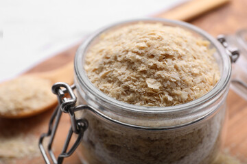 Beer yeast flakes on white wooden table, closeup