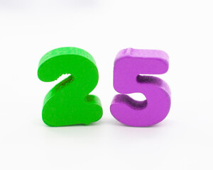 25 colorful wooden numbers decorative on the white