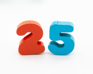 25 colorful wooden numbers decorative on the white