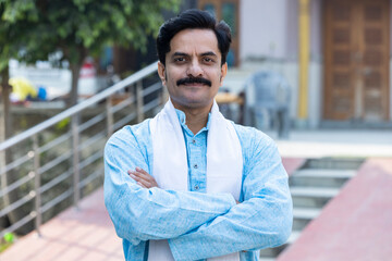 Portrait of indian young villager in traditional clothes.