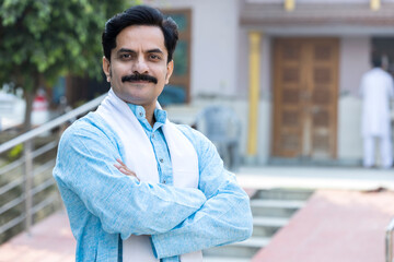 Portrait of indian young villager in traditional clothes.