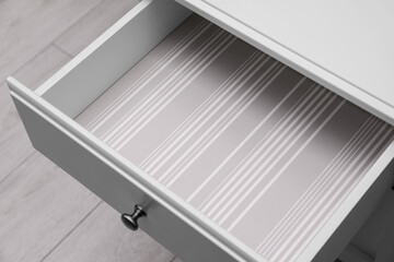 Stylish desk with open empty drawer, above view