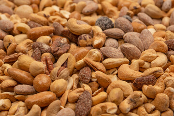 A group of almonds, pistachios, walnuts, macadamia, cashews.