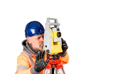 A builder in a hat and orange reflective fleece gives STOP sign on white background with space for text. Site engineer using modern surveying equipment isolate on white background