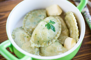 Boiled dumplings with stuffing inside, from dough with herbs