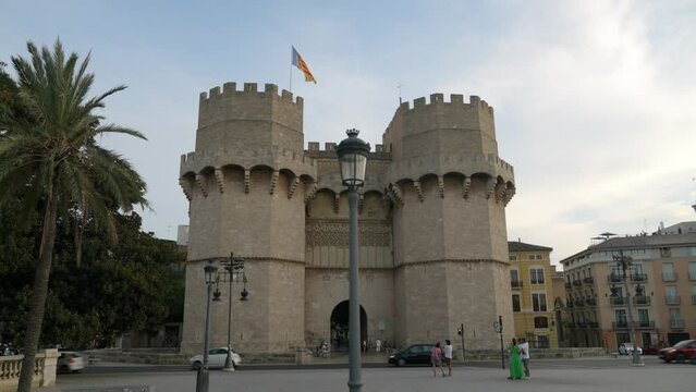 Moving shot of landmark Serrano towers at summer day in Valencia old town, Spain