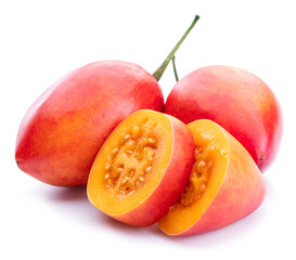 Ripe tamarillo fruits with tamarillo slices  isolated on a white background.