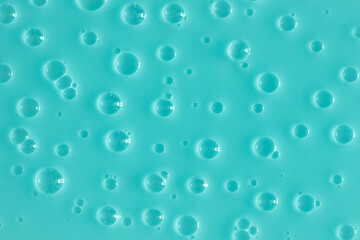 Bubble mint turquoise background texture. Berry gel to cleanse the skin of the face and body. Spa treatments, skin care. Bath foam, detergent. Slime blue