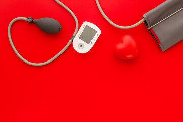 Red heart and blood pressure monitor. Heart diseases diagnosis concept