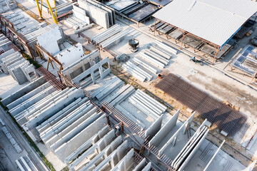 Aerial top view of Precast concrete wall panel for construction building site in warehouse factory....