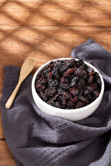 Healthy Food - Nuts Dehydrated Grapes; Photo On Wooden Background