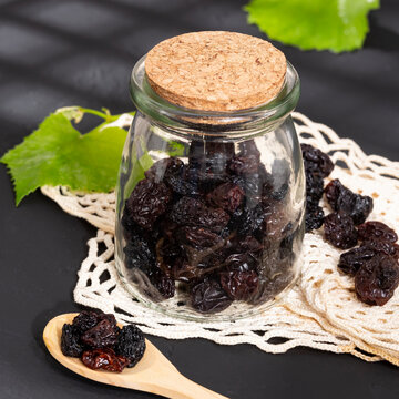 Healthy Food - Nuts Dehydrated Grapes; Photo On Dark Background