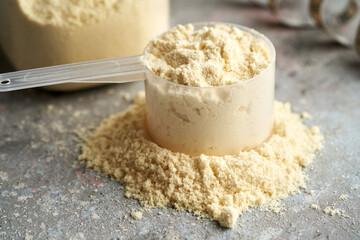 Whey protein powder in a measuring cup