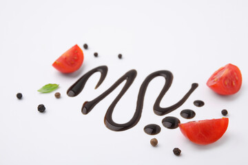 Organic balsamic vinegar and cooking ingredients on white background