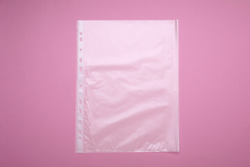 Punched pocket on pink background, top view