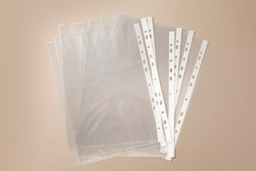 Punched pockets on light grey background, flat lay