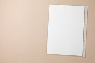 Punched pocket with paper sheet on light grey background, top view. Space for text