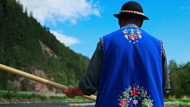 Traditional rafting on the Dunajec River on wooden boats. The rafting is very popular tourist attraction in Pieniny National Park. 