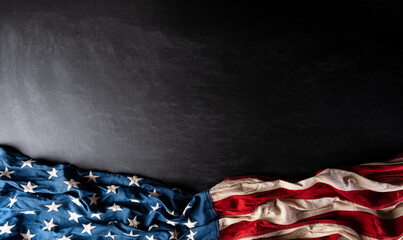 Happy Presidents Day. American flags against dark wooden background.