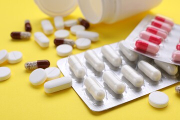 Different antidepressants on yellow background, closeup view