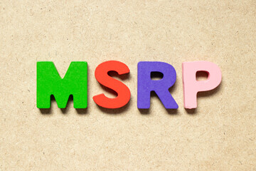 Color alphabet letter in word MSRP (Abbreviation of manufacturer's suggested retail price) on wood...