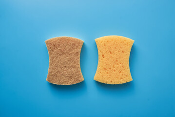 Yellow dish sponge on blue  background