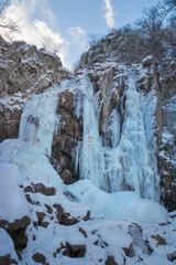 Fototapeta na wymiar Frozen Boyana waterfall in Vitosha mountain, Bulgaria