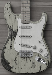 This is rock'n'roll. Impression of a worn out guitar - 568780141