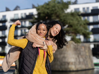 Two young women in urban setting, portrait