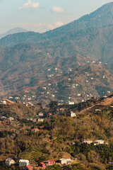 Fototapeta na wymiar Village in the mountains. Mountain View. People live in the mountains