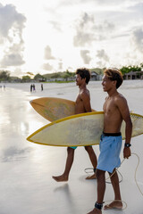 Fototapeta Indonesia, Lombok, Two surfers walking into sea obraz