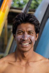 Fototapeta Portrait of smiling surfer with sun lotion on face obraz