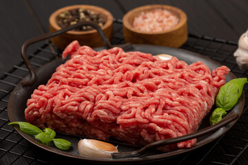 Raw homemade minced meat on a tin plate